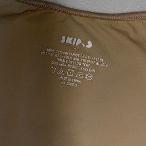 Skims fits everybody sleeveless mock neck bodysuit; shade (SAND)